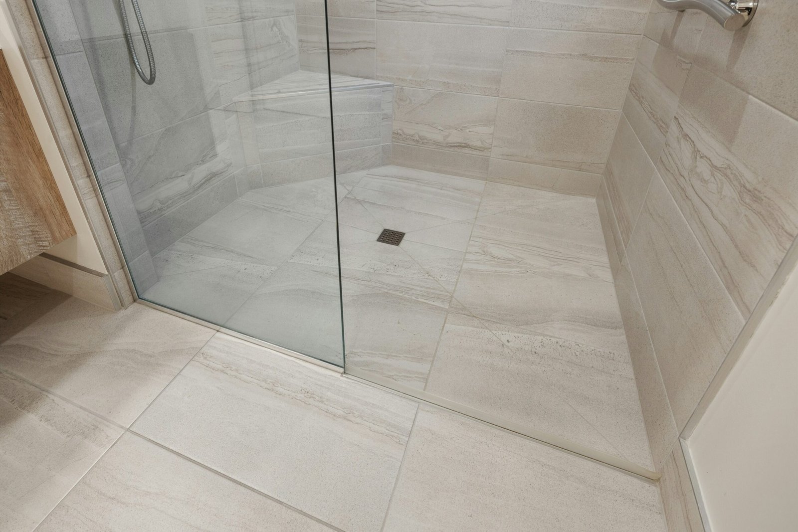 Clean white tile and grout bathroom